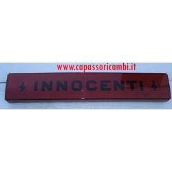 catarifrangente posteriore con scritta  " innocenti "